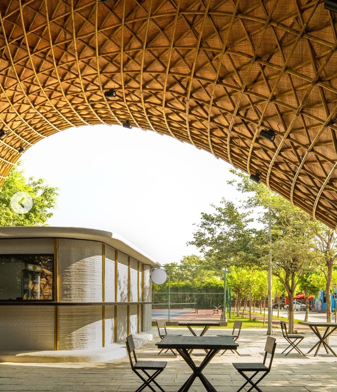 Seating area beneath the lattice canopy at the Ashoka University canteen.