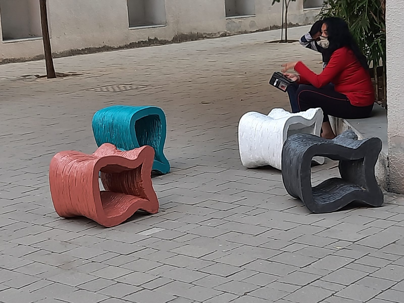 3D printed concrete outdoor furniture in a range of finishes.