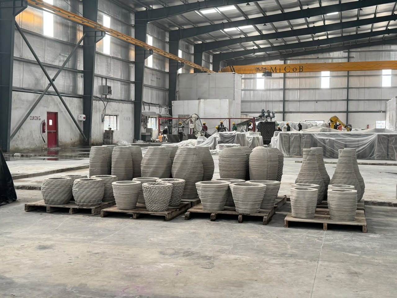 Printed construction elements staged in the plant after a production run.