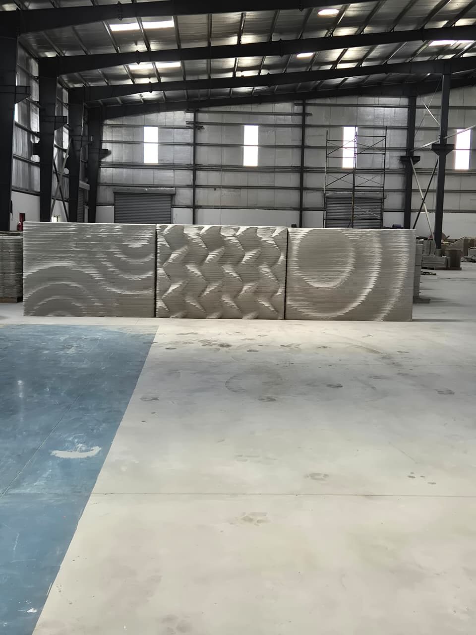 Printed wall panels with a flowing surface texture achieved directly through toolpath design.